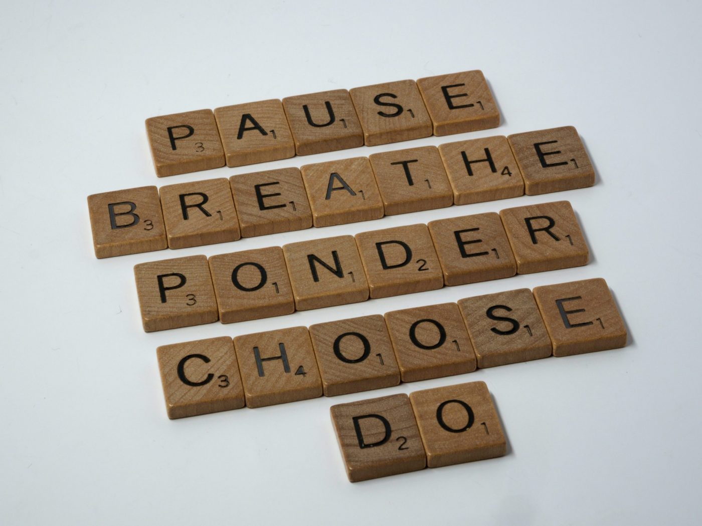 scrabble tiles saying pause breathe ponder choose do