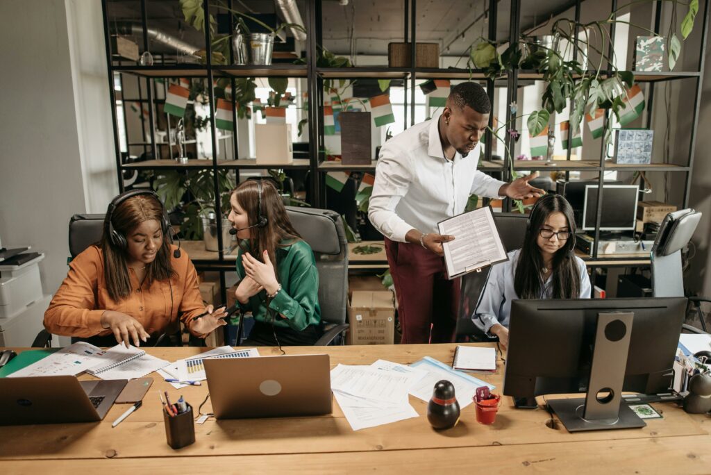 4 people in a busy office