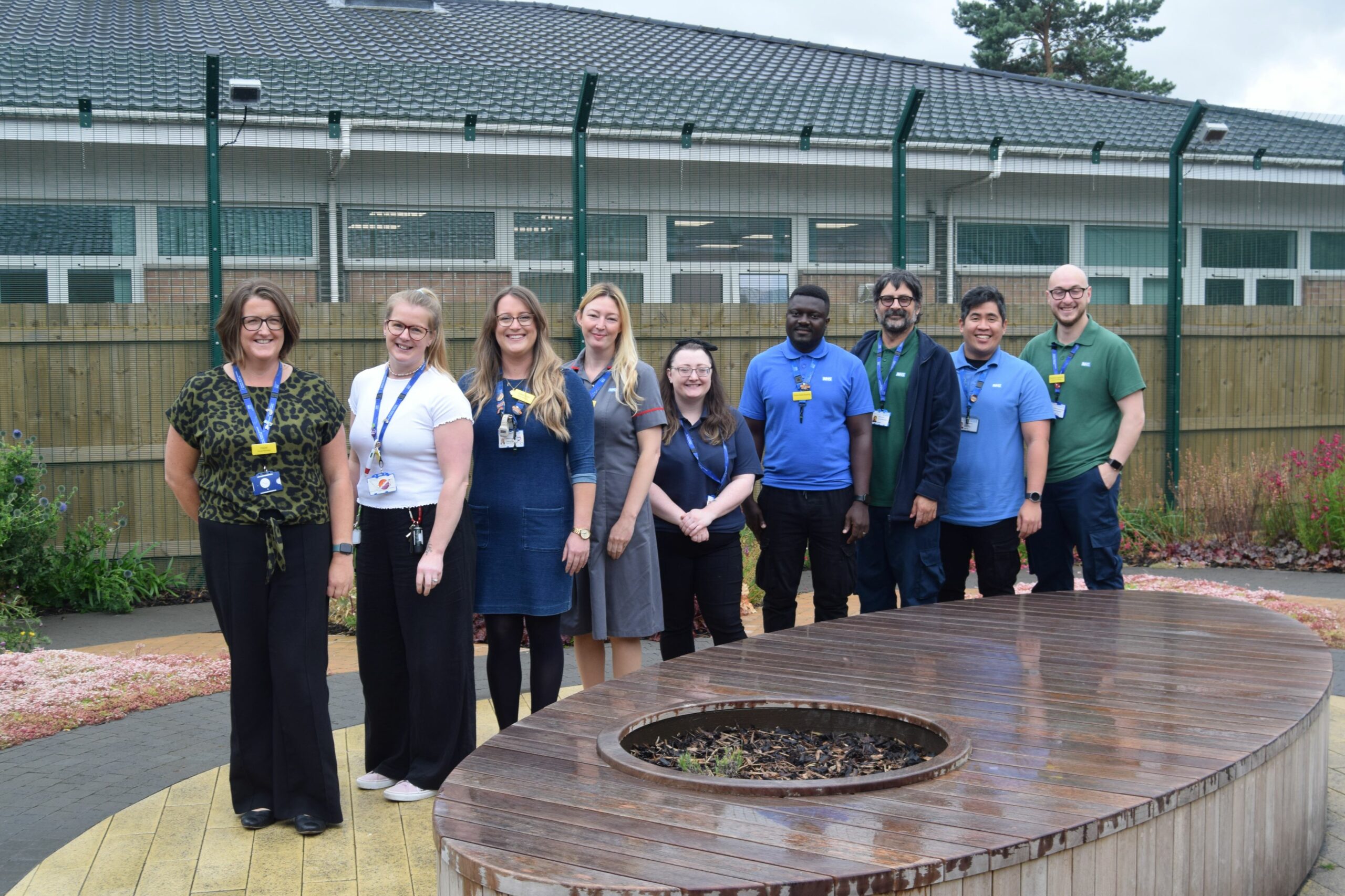 Rowan ward clinical team standing in the garden