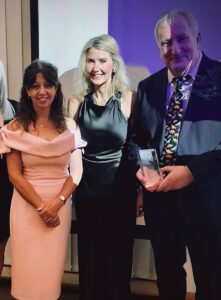 A photo of three colleagues from our children's community nursing service at an awards ceremony